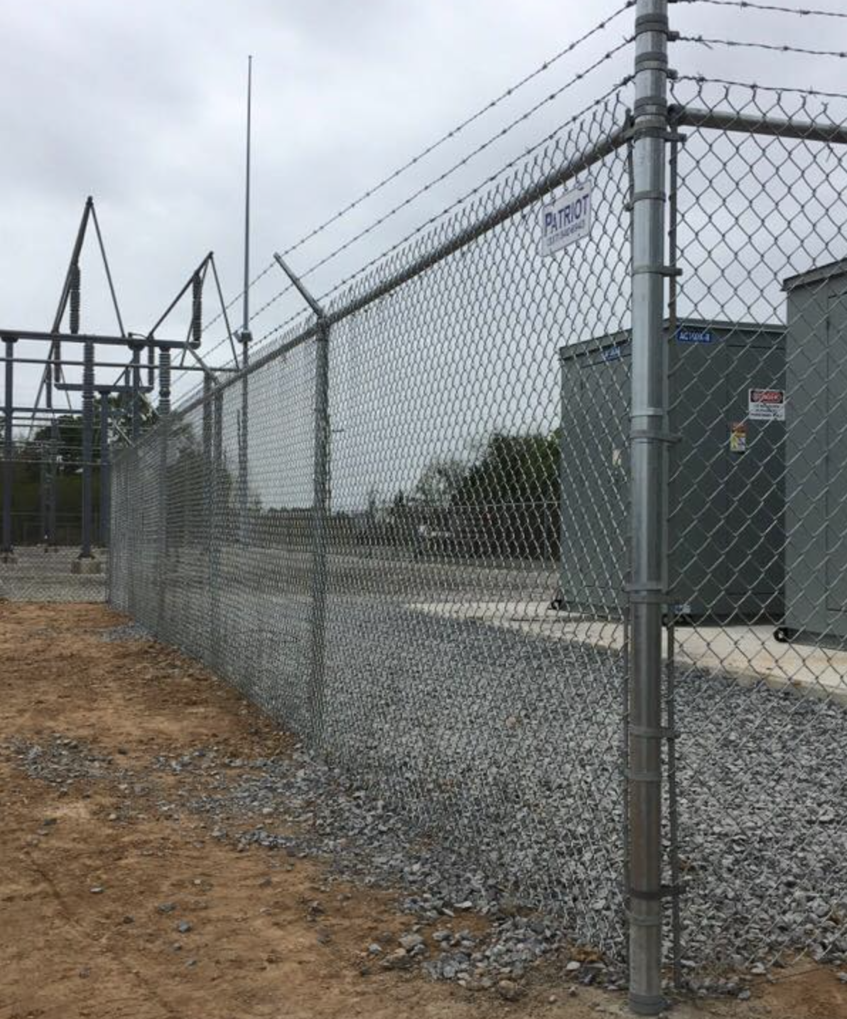 Security fencing at an electrical substation with Patriot sign